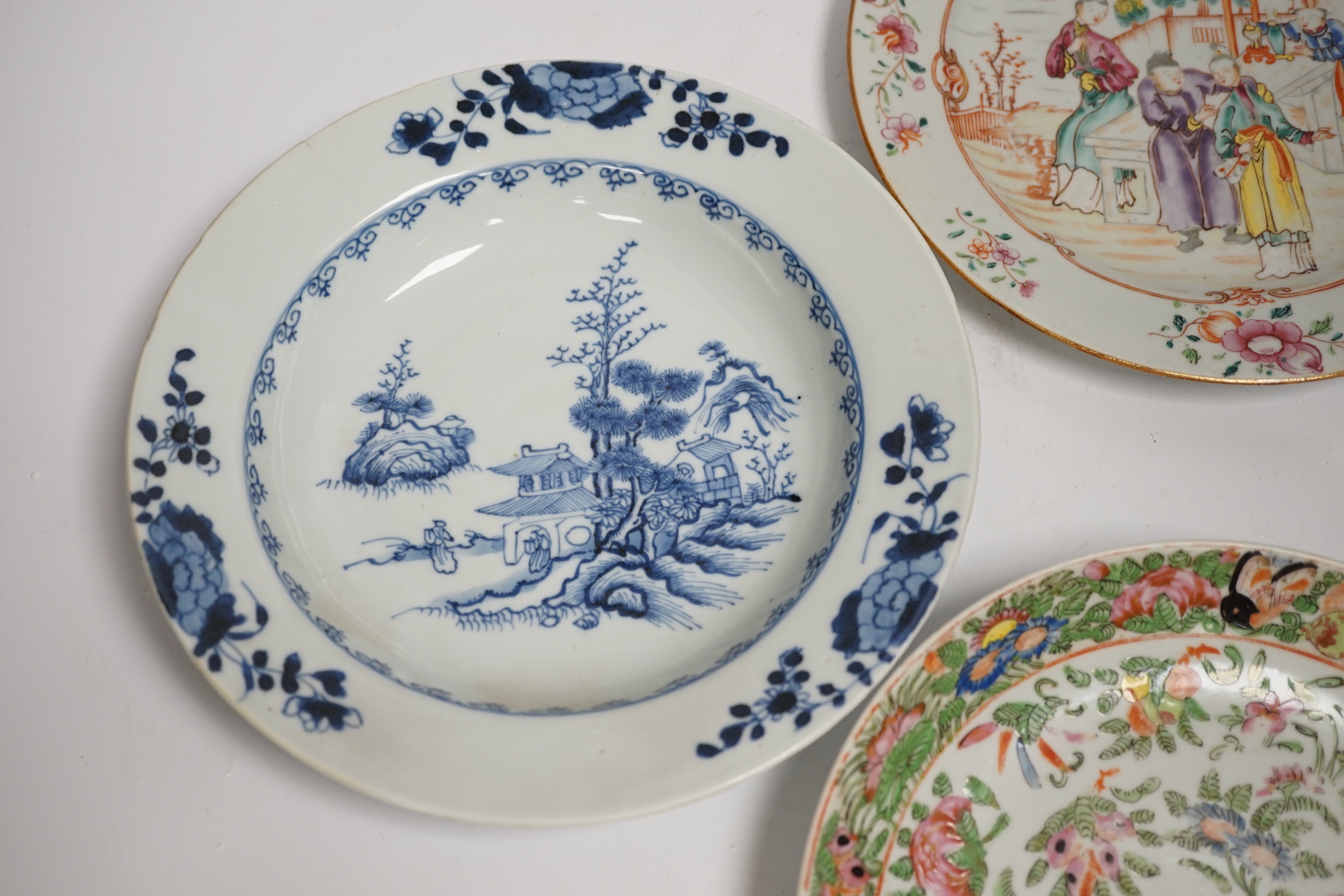 Two 18th century Chinese export plates and a 19th century Canton plate, largest 23cm